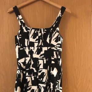 Black & white tea-length tank dress.